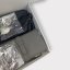 Černo-šedý box FLOS